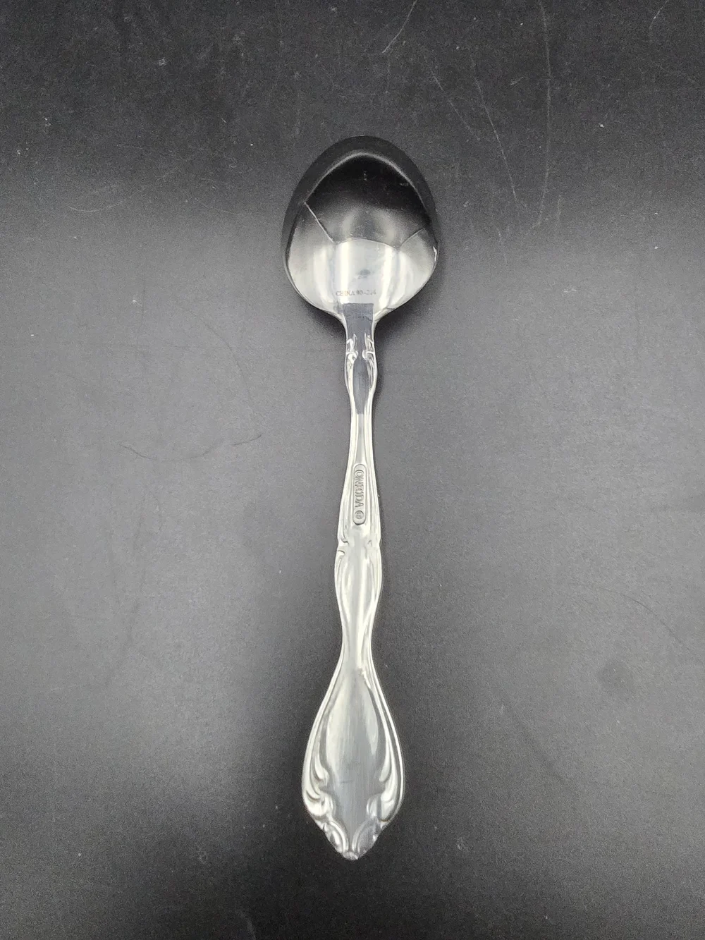 Oneida Silver Tone Ornate Serving Spoon